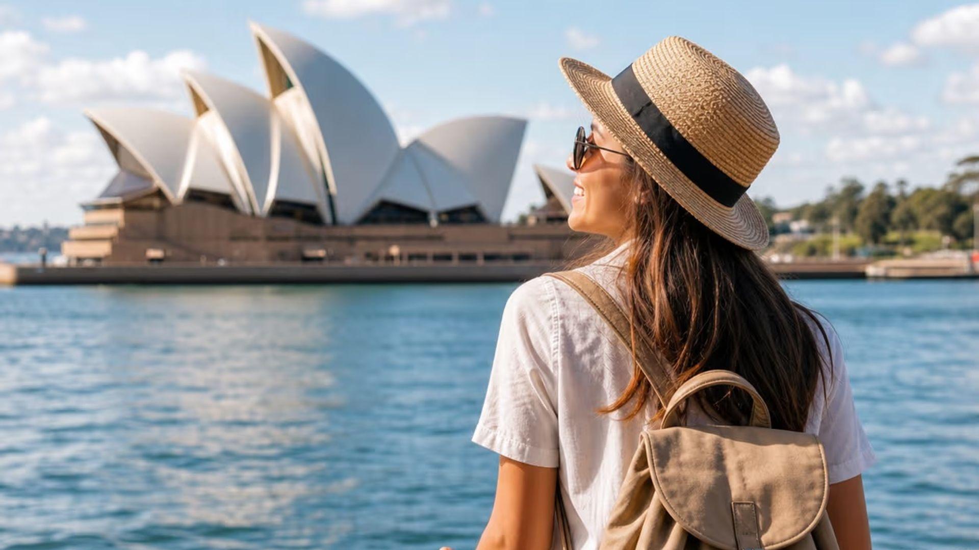 Young woman looking at Sydney opera house